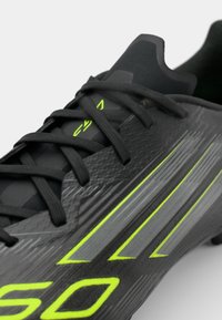 adidas Performance F50 LEAGUE FG/MG - Firm-ground football boots - core black/iron metallic/lucid lemon