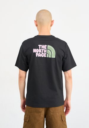 Black cotton t-shirt featuring a colorful graphic on the back with the text "THE NORTH FACE" and a green curved design element.