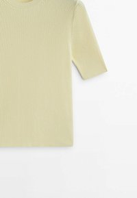 Light yellow ribbed short-sleeve top with a round neckline, featuring a soft texture and fitted design. No visible patterns or accents.