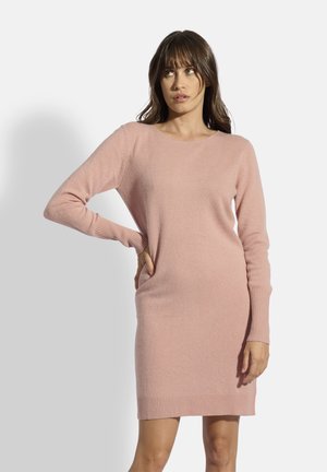Neulemekko pehmeässä vaaleanpunaisessa värissä, jossa on pitkät hihat, ribbireunat hihansuissa ja helmassa, pyöreä kaula-aukko sekä tiukka malli.