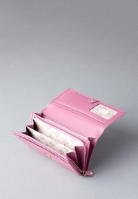 Pink leather wallet featuring a textured exterior, multiple compartments, and a zippered pocket. Interior has a patterned lining and ID window.
