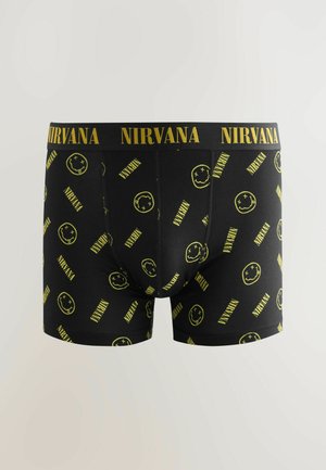 Zwarte boxershorts met gele "NIRVANA" tekst en een smilygezicht-patroon. Gemaakt van zachte stof, met een elastische tailleband voor comfort.
