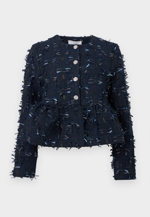 Navy jacket in textured fabric with fringe detail, five silver buttons, and peplum design. Features a round neckline and long sleeves.