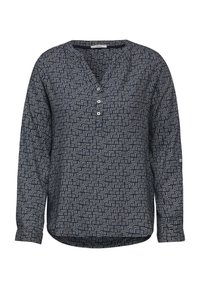 Blusa a maniche lunghe in blu scuro con un motivo geometrico bianco. Presenta un collo a V, un placket con bottoni e un orlo curvo. Tessuto morbido al tatto.