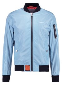 Světle modrá bomber bunda, nylonový materiál, zip vpředu, černé vroubkované manžety, boční kapsy, kapsa na zip na levém rukávu, oranžová etiketa na lemu.