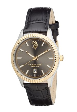Orologio da polso rotondo con cinturino in pelle nera, lunetta scanalata dorata, quadrante grigio scuro, indici e lancette dorati, logo U.S. Polo Assn. e datario alle ore 6.
