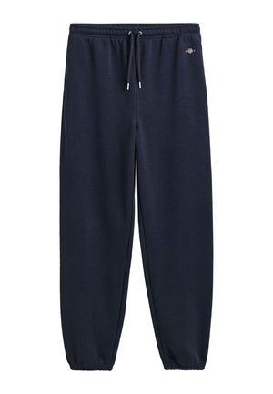 Pantaloni da tuta blu navy realizzati in tessuto morbido, con vita elastica e cordino, polsini alle caviglie e un piccolo logo decorativo.