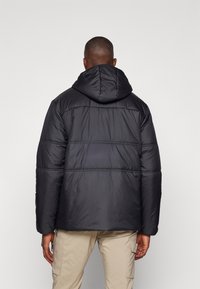 Vaude NEYLAND HOODED  - Winterjas - black