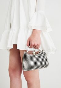 Selected, silver-coloured