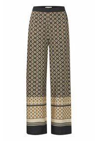 Pantalons larges noirs avec un motif géométrique doré et crème. Taille élastique avec un tissu texturé contrastant à l'ourlet et au bas.