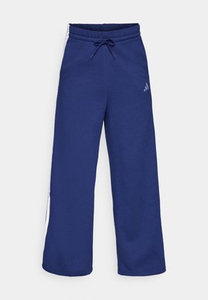 Marineblaue Sweatpants mit einem Kordelzugbund und seitlichen weißen Streifen. Hergestellt aus weichem Stoff mit einer bequemen Passform; das Adidas-Logo ist abgebildet.
