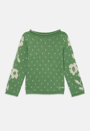 Grønn strikkegenser med hvite blomster mønstre på ermene, teksturerte prikker på kroppen, og en ribbestrikket rund hals.