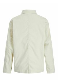 Light beige long-sleeve jacket with a collar, visible seam down the center back, and slightly textured fabric.