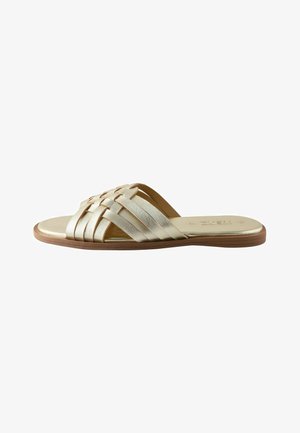 Flat sandal with metallic gold woven straps and a brown sole, designed for casual wear.