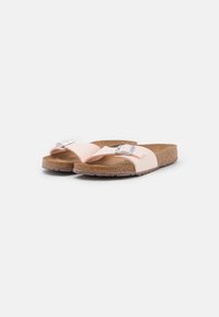 Pink slide sandals with a cork footbed, featuring a single buckle strap and open toe design. Smooth upper material and textured sole.