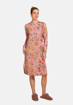 Long-sleeve pink dress with floral embroidery, featuring a button-up neckline and side slits, paired with brown fuzzy slippers.