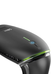 Black handheld device with a sleek design, featuring a power button, a green indicator light, and vented sections for airflow.