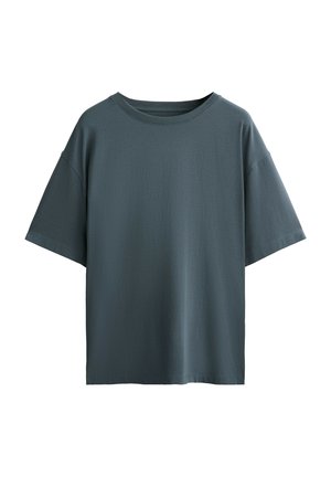 Effen donkergroene oversized T-shirt met korte mouwen en een ronde halslijn, weergegeven op een witte achtergrond.