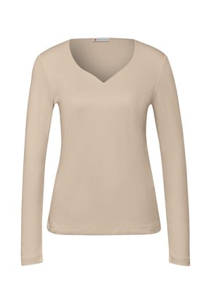 Béžový dlouhý rukáv V-krk top vyrobený z jemné bavlny. Má přiléhavý střih a jemné prošívání podél lemu a rukávů.