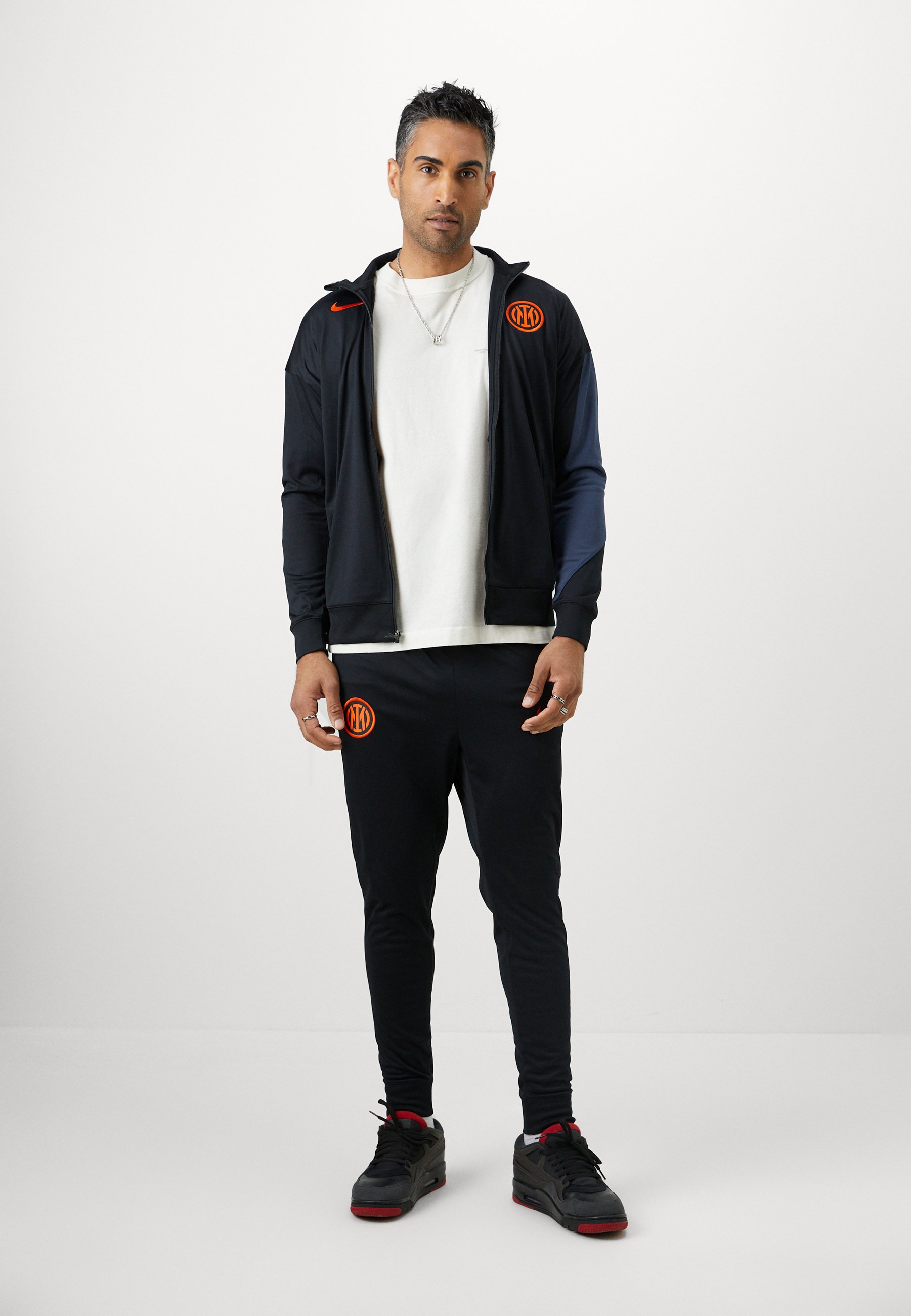 nike black and orange tracksuit