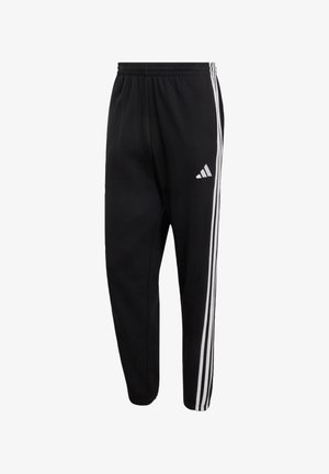 adidas Sportswear, ESSENTIALS 3-STRIPES FRENCH TERRY TAPERED CUFFED PANTS - Trainingsbroek - black/white