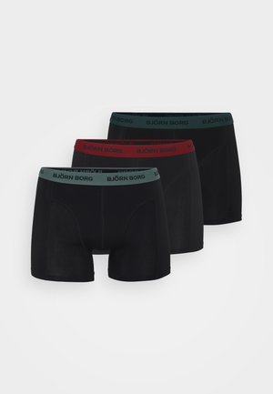 Juoda bokso apatiniai šortai su plačiu elastingu diržu. Vienas diržas yra žalias, kitas raudonas, visi su "BJÖRN BORG" logotipu.