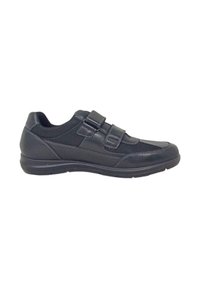 Sneaker nera con due cinturini in velcro, materiali sintetici e tessili lisci, punta arrotondata, suola imbottita e dettagli di cucitura sottili.