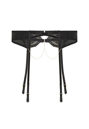 Jarretière en dentelle noire avec quatre bretelles réglables et une délicate chaîne en or ornant le devant, sur un fond blanc uni.