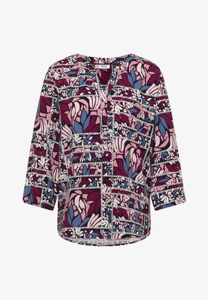 Bluzka z długim rękawem i dekoltem w serek, ozdobiona wielokolorowym abstrakcyjnym kwiatowym wzorem w odcieniach różu, fioletu i niebieskiego.
