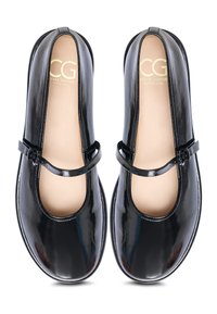 Chaussures Mary Jane en cuir verni noir avec un bout arrondi, dotées d'une bride avec une petite boucle et d'une semelle intérieure beige clair.