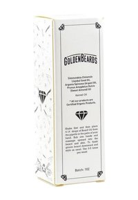Skäggolja i låda med vit bakgrund och svart text. Innehåller diamantgrafik, lista över ekologiska ingredienser och instruktioner för applicering.