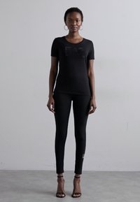 EA7 Emporio Armani Κολάν - Παντελόνια - black/gold-coloured