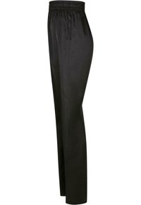 Pantalon noir taille haute avec ceinture élastique et poches latérales, coupe droite et tissu lisse.