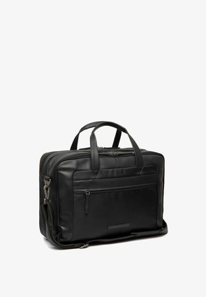 Malette en cuir noir avec deux poignées supérieures, une bandoulière amovible, une poche zippée à l'avant et plusieurs compartiments pour l'organisation.