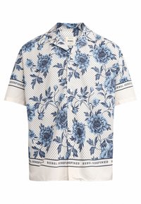 Korte mouwen overhemd met een blauw bloemenpatroon, kleine zwarte stippen op een witte achtergrond, en de tekst "REBEL REDEFINED" op de mouwen en de zoom.