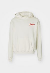 Sudadera color crema hecha de tejido suave, con un bolsillo frontal, puños de canalé y el logo bordado de "Benfica" en rojo en el pecho.