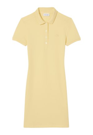 Abito polo giallo, maniche corte, colletto, placket con cinque bottoni, con piccolo logo ricamato sul petto sinistro. Materiale in cotone morbido.