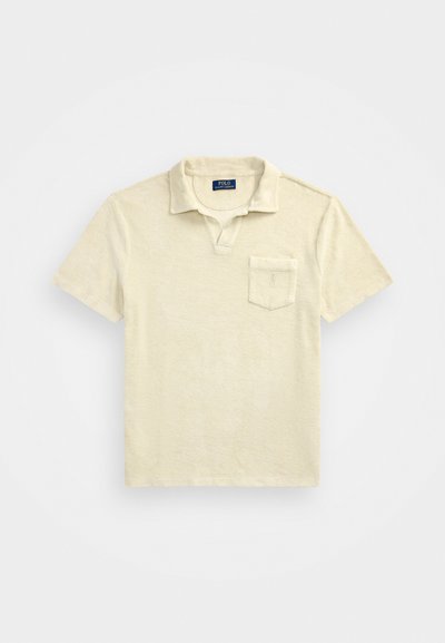 Korte mouw polo-shirt in lichtbeige, gemaakt van zachte katoen, met een kraag en een borstzak. Geweven stof met een losse pasvorm.