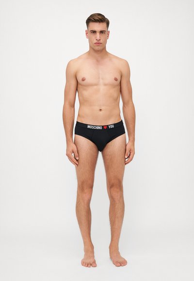 Black cotton briefs with a contrasting logo waistband. Features a snug fit and standard cut, designed for comfort and support.