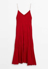 Punainen hihaton mekko V-kaula-aukolla, ristikohtaisella tekstuurilla ja levenevällä helmalla. Valmistettu kevyestä kankaasta, jossa on säädettävät hihnat.