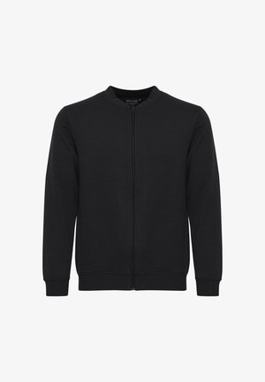 Svart zip-up hettegenser med ribbestruktur, rund halslinning og lange ermer. Enkel design uten synlige logoer eller detaljer.