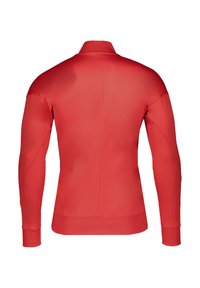 Red athletic jacket with a high collar, long sleeves, and textured ribbed cuffs. Smooth fabric and fitted design, detailed stitching visible.