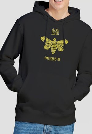 Black hoodie featuring a yellow graphic of a bee and the text "00892-B" with a textured finish. Made from soft, comfortable fabric.