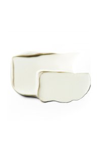 White ceramic dish with an organic shape, featuring a smooth texture and subtle glossy finish, showcasing curved edges and a minimalist design.