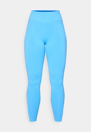 Leggings blu realizzati in un tessuto elasticizzato con un alto elastico in vita. Texture liscia e design aderente, che si estende fino alla caviglia.