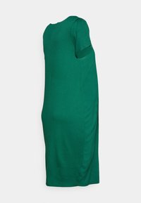 Vestido verde de manga curta com um corpete justo e pequenos detalhes franzidos dos lados. Feito de um tecido liso com uma cor sólida.
