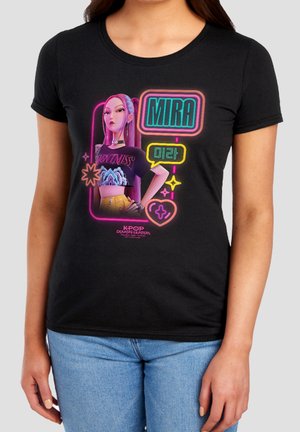 Woman wearing a black T-shirt with neon-style graphic of a confident animated girl and the name "Mira" in English and Korean.