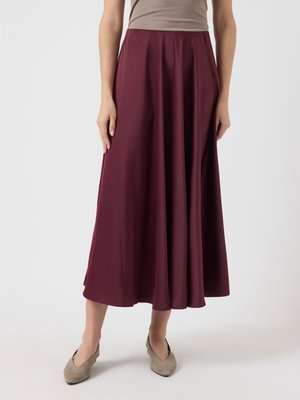 Burgundy, knee-length skirt with a smooth, flowing fabric, featuring a fitted waist and pleated design for added movement.