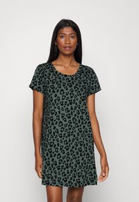 Short-sleeve, knee-length dress in dark green with black leopard print. Soft fabric, round neckline, relaxed fit, and no visible hardware.