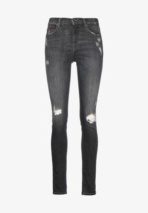 Zwarte skinny jeans met vervaagde, versleten stukken op de dijen en knieën, vijf zakken en een knoopsluiting in de taille.